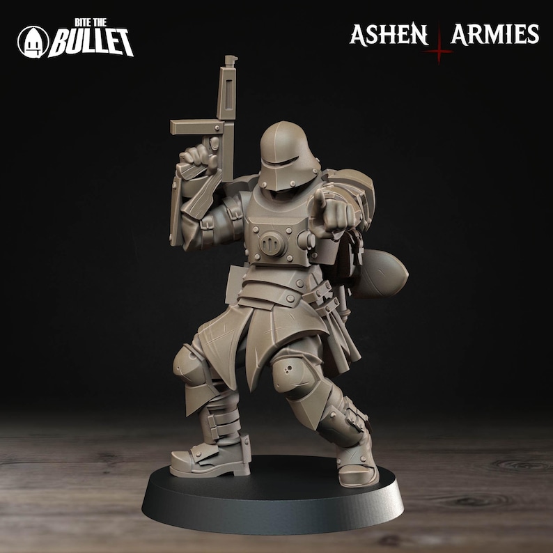 May include: A gray miniature figurine of a soldier in full armor, holding a rifle and pointing. The figurine is on a black base. The text "Bite the Bullet" and "Ashen Armies" are visible.