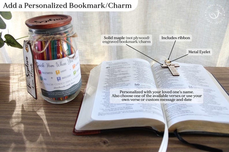May include: A personalized bookmark and charm set. The image shows a wooden cross bookmark with a ribbon, resting on an open book. A jar filled with colorful sticks and a personalized tag are also visible. The bookmark is engraved with a name and can be customized.