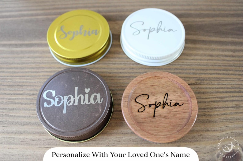 May include: Four personalized jar lids in gold, white, brown, and wood tones, each with the name "Sophia" engraved. The image includes the text "Personalize With Your Loved One's Name".
