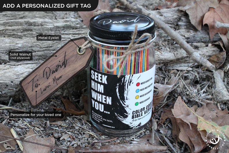 May include: A personalised gift jar with a black lid and a wooden tag. The jar contains colourful sticks and a label that reads "Seek Him When You..." The wooden tag is engraved with "To: David, I Love Mom."