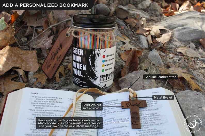 May include: A wooden cross pendant with the name "David" and a personalized bookmark rest on an open book. A glass jar filled with colourful paper strips and the text "Seek Him When You..." is also visible.