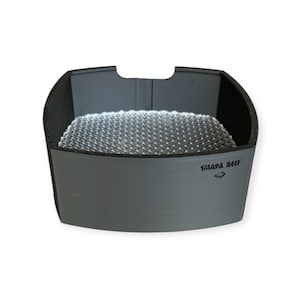 May include: A gray plastic container with a black mesh insert. The container has the words "SMAPA REEF" printed on the side.