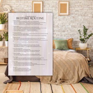 May include: A white and gray printable checklist with the title "Comprehensive Bedtime Routine" with a list of tips for creating a relaxing bedtime routine. The checklist is on a table next to a bed with a tan knitted blanket and a green and brown throw pillow.