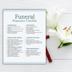 May include: A funeral preparation checklist with the title "Funeral Preparation Checklist" in a stylized font. The checklist is divided into sections: Preparations, Participants, Funeral Home Services, Cemetery Selections, and Final Arrangements. White lilies and a wooden cross are in the background.
