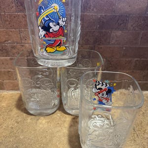 A set of 4 collectible Walt Disney Glasses