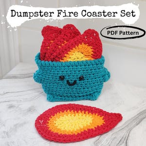 May include: Crocheted coaster set featuring a teal dumpster with a smiling face, holding red, yellow, and orange flames. Includes a matching coaster. The text "Dumpster Fire Coaster Set" and "PDF Pattern" are visible.