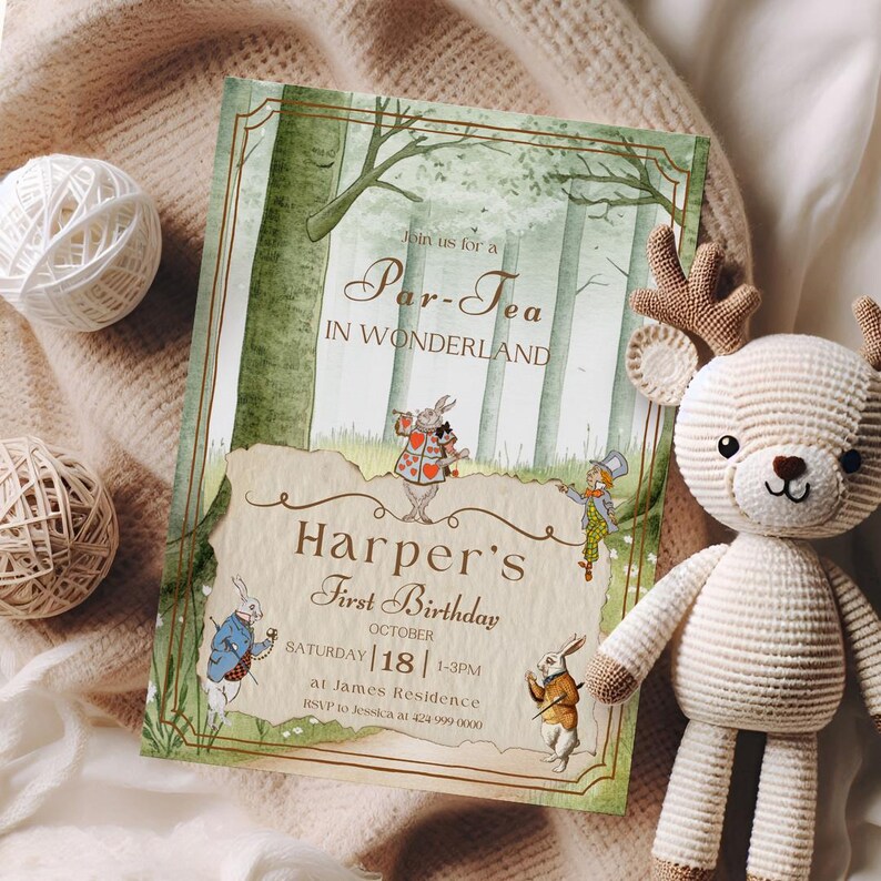 May include: An invitation for a "Par-Tea in Wonderland" featuring illustrations of characters from Alice in Wonderland. The invitation is for Harper's First Birthday, with the date and time listed. A crocheted deer toy and yarn balls are also in the image.