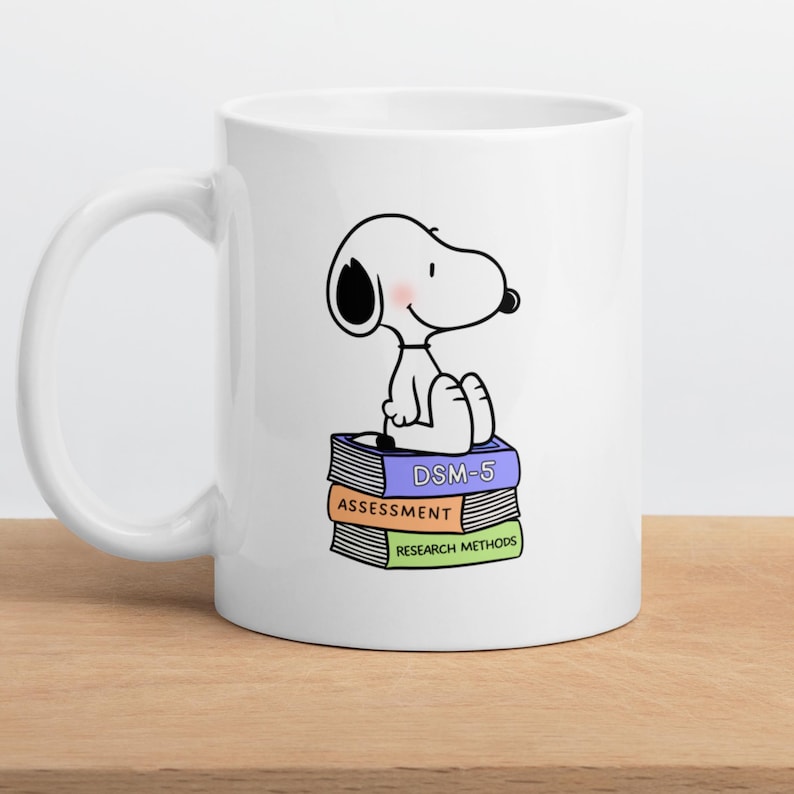 May include: A set of three ceramic mugs with a speckled, matte finish. The mugs are in shades of cream, light gray, and dark gray. Each mug has a simple, minimalist design, perfect for coffee or tea.