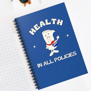 May include: A spiral-bound notebook with a blue cover featuring the word "HEALTH" in white. The cover also displays a cartoon illustration of a bill with a red, white, and blue "BILL" button. The text "IN ALL POLICIES" is printed below.