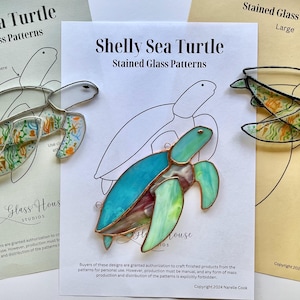 May include: A stained glass pattern for a sea turtle with a turquoise, green, and pink shell. The pattern is printed on a white sheet of paper with the title "Shelly Sea Turtle Stained Glass Patterns".