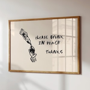 Puede incluir: Una taza de cerámica blanca con un asa negra y el texto "But First, Coffee" en negro, en negrita. La taza está sobre una superficie blanca.