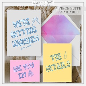 May include: A three-piece wedding invitation suite with a light blue and pink envelope, a white card with blue text that says "We're getting married! June 1, 2023", a pink card with blue text that says "Are you in?" and a yellow card with blue text that says "The Details".