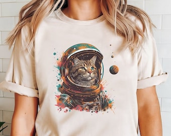 宇宙飛行士猫Tシャツ：宇宙のゴロゴロ音を立てるユニセックスTシャツ