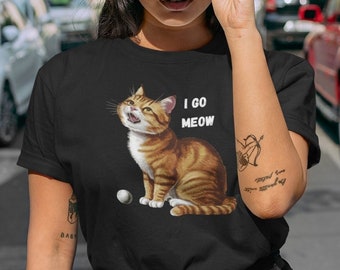 May include: A black t-shirt featuring a cartoon orange tabby cat and the text "I go MEOW".