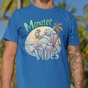 Manatee T-Shirt Relaxing Summer Tee with Tropical Sunset Cute Animal Drinking Cocktail Graphic Unisex Vacation Shirt Gift for Manatee Lover