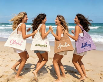 May include: Four crochet tote bags with open-knit tops and solid bottoms. Each bag features a personalized name in cursive script: Olivia in pink, Amanda in green, Amilia in white, and Ashley in dark blue, each with a small matching flower accent.