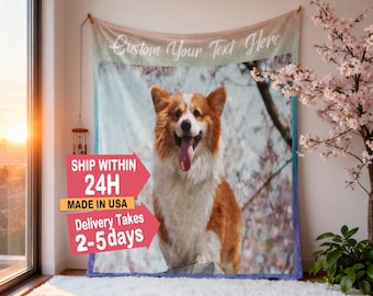 May include: A custom blanket featuring a smiling corgi with a pink tongue, set against a backdrop of cherry blossoms. The blanket has the text "Custom Your Text Here" at the top.
