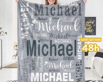 May include: Gray fleece blanket with the name "Michael" repeated in various sizes and styles. The name is printed in white and black on a gray background.