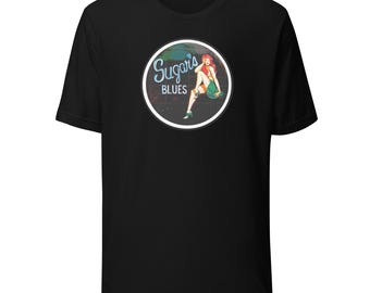 May include: Black t-shirt with a vintage-style logo featuring a woman in a green skirt and the text "Sugar's Blues".