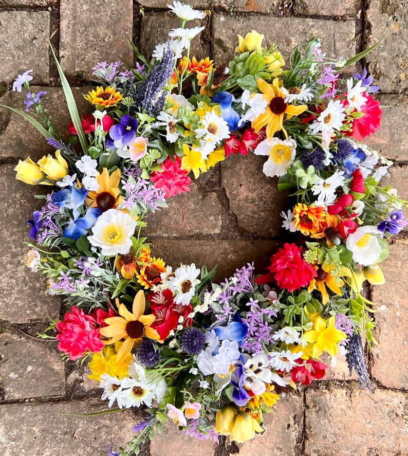 All season round grapevine wreath featuring multiple colors of Texas wildflowers including bluebonnets and Indian paintbrush perfect gift image 1