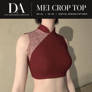 May include: A sleeveless crop top in deep red with a high collar and an asymmetrical panel featuring a light pink floral lace pattern. The text at the top reads DA THE DESIGNERS ARCHIVE MEI CROP TOP XS-XL | 34-42 | DIGITAL SEWING PATTERN.