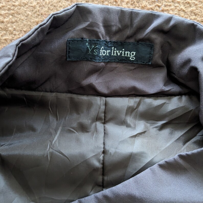 May include: A black jacket with a Y's for living label on the inside collar.