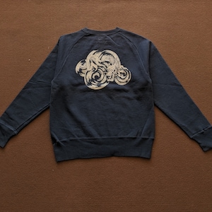 May include: A dark blue sweatshirt with a white graphic of a dragon in a cloud design on the back.