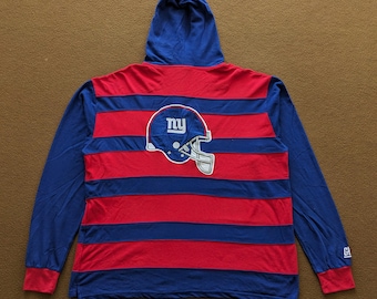 May include: A blue and red striped long-sleeved hoodie with a New York Giants logo on the back. The logo is a white helmet with a blue "NY" on the front.