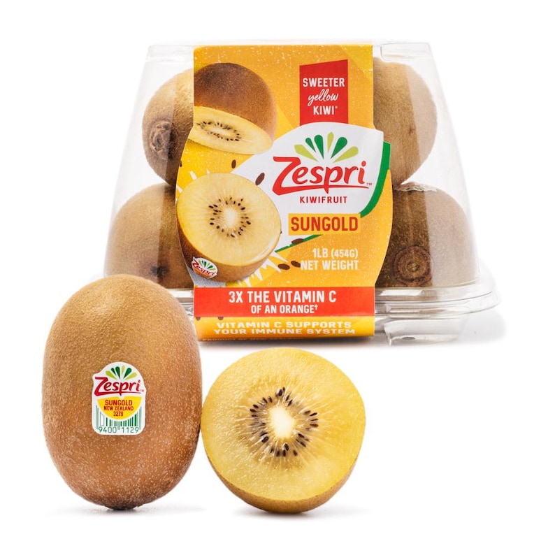 May include: A clear plastic container filled with Zespri Sungold kiwifruit, labeled 1LB (454G) net weight, alongside one whole kiwi with a Zespri sticker and one halved kiwi showing yellow flesh and small black seeds, with text highlighting 3X the vitamin C of an orange.