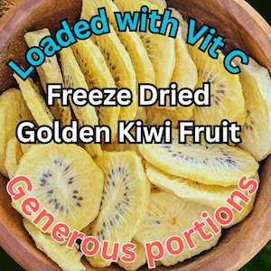 May include: A wooden bowl filled with thin, yellow, freeze-dried golden kiwi fruit slices. The text on the image reads: Loaded with Vit C, Freeze Dried Golden Kiwi Fruit, Generous portions. The fruit slices show visible dark seeds.