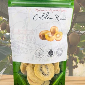 May include: A green resealable pouch containing dried golden kiwi slices. The label features the text Nature in its purest form Golden Kiwi, an illustration of whole and sliced kiwis, and icons indicating gluten-free, non-GMO, and no added sugar.