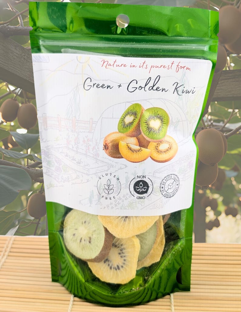 May include: A green resealable pouch containing dried fruit slices. The label features the text Nature in its purest form Green + Golden Kiwi, illustrations of whole and sliced kiwi fruit, and icons for Gluten Free, Non GMO, and No Added Sugar.