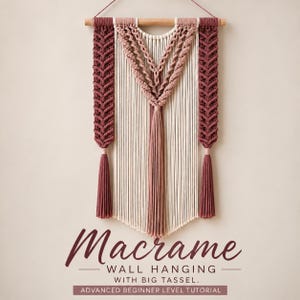 May include: A macrame wall hanging featuring cream and dusty rose cotton cords suspended from a wooden dowel. The design includes intricate braided side panels, a central knotted pattern, and long tassels. Text reads: Macrame WALL HANGING WITH BIG TASSEL. ADVANCED BEGINNER LEVEL TUTORIAL.