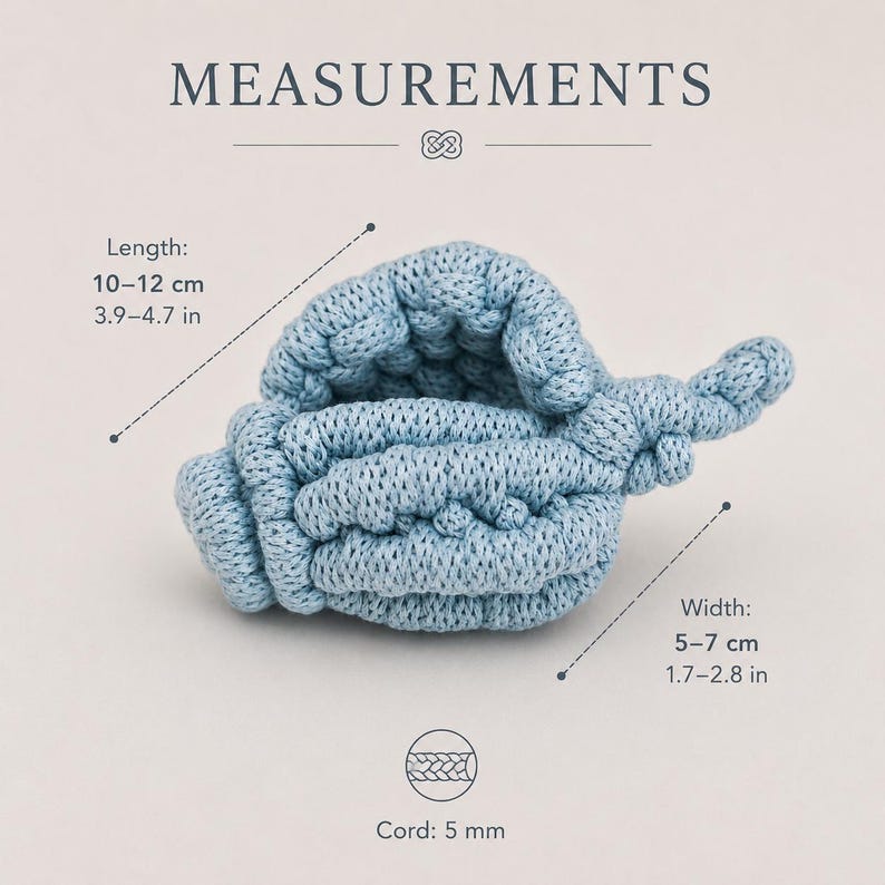 May include: A light blue crocheted seashell shape with a textured surface. The text MEASUREMENTS is at the top. The length is 3.9-4.7 inches, the width is 1.7-2.8 inches, and the cord thickness is 5 mm as indicated by the visible labels.