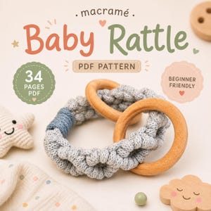 May include: A macramé baby rattle PDF pattern featuring two interlocking wooden rings wrapped in light gray cord with a blue accent section. The text reads macramé Baby Rattle PDF PATTERN, 34 PAGES PDF, and BEGINNER FRIENDLY, with small star, heart, and cloud shapes.