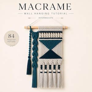May include: A macrame wall hanging tutorial PDF pattern featuring 84 pages. The macrame piece is crafted from cream and dark teal cord on a wooden dowel, showcasing intricate knot work, geometric patterns, and long decorative tassels.