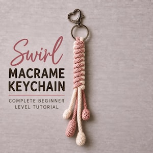 May include: A macrame keyring featuring a heart-shaped metal clasp and a spiral knot pattern in alternating dusty rose and cream cord. The text reads Swirl MACRAME KEYCHAIN COMPLETE BEGINNER LEVEL TUTORIAL. The cord ends in four knotted tassels.