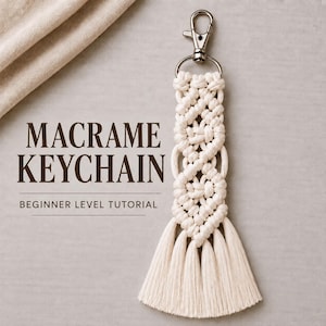 May include: A cream-colored macrame keychain featuring intricate knotted patterns and a long fringe tassel at the bottom. The keychain is attached to a silver-toned metal lobster clasp. The text MACRAME KEYCHAIN BEGINNER LEVEL TUTORIAL is visible.