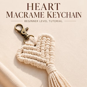 May include: A heart-shaped macrame keychain made of off-white cord with a bronze-toned metal lobster clasp. The text "HEART MACRAME KEYCHAIN" and "BEGINNER LEVEL TUTORIAL" is printed in dark brown above the keychain.