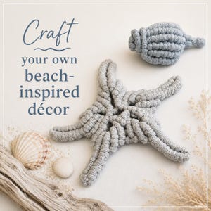 May include: A light gray crocheted starfish and a matching crocheted seashell. The text "Craft your own beach-inspired d&eacute;cor" is printed in blue. Also included are a natural seashell, a small white stone, and a piece of driftwood.