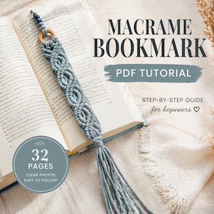 May include: A light blue macrame bookmark lies on an open book. The bookmark has a woven pattern, a wooden ring, and a tassel. The image includes text: "MACRAME BOOKMARK PDF TUTORIAL" and "32 PAGES CLEAR PHOTOS EASY TO FOLLOW".