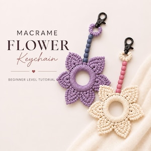 May include: Two macrame flower keychains with black metal lobster clasps. One keychain features a purple flower with a purple bead strand, and the other features a cream flower with a pink bead strand. Text reads MACRAME FLOWER Keychain BEGINNER LEVEL TUTORIAL.
