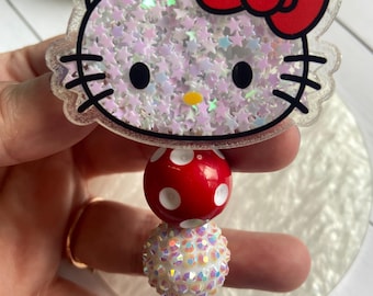 Kitty shaker badge reel with beaded red and white retractable reel.