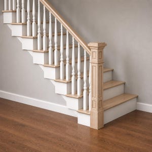 May include: A wooden staircase with white risers and balusters, and natural wood treads and handrail. The staircase has a classic design, with a newel post and a hardwood floor.