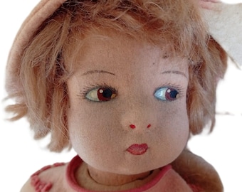 Lenci Grugnetto felt doll, Italy c.1930s. Swivel head, painted side-glancing eyes, mohair hair, original pink scalloped dress & matching hat