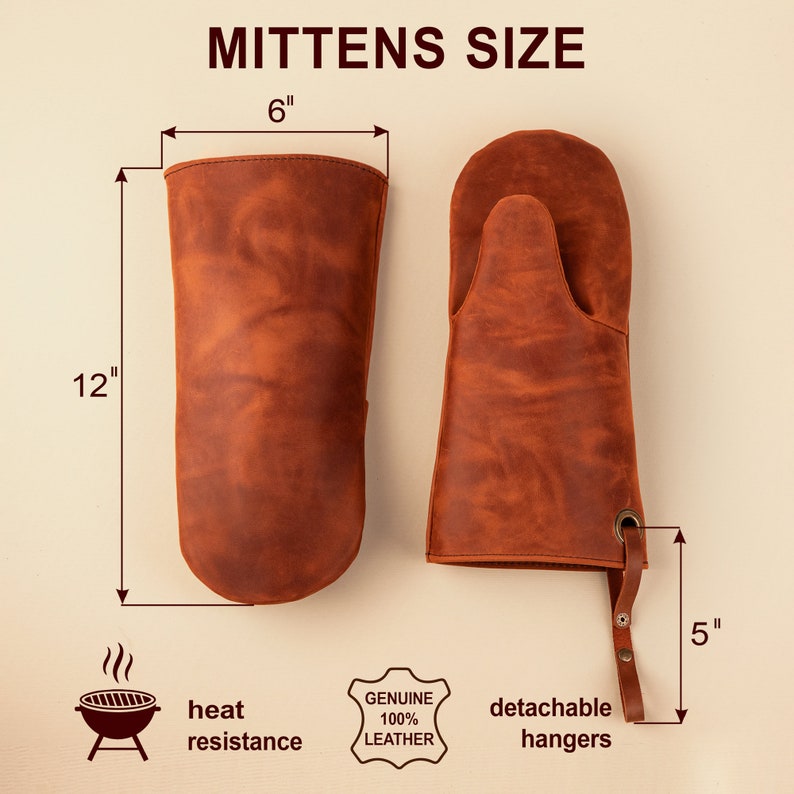 May include: Brown leather oven mitts with detachable hangers. The mitts are 12 inches long and 6 inches wide. The hangers are 5 inches long. The mitts are made of 100% genuine leather and are heat resistant.