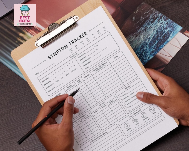 May include: A white paper symptom tracker form with black text and lines, secured on a light brown wooden clipboard. The form includes sections for date, energy level, stress, sleep, temperature, heart rate, blood pressure, and daily notes.