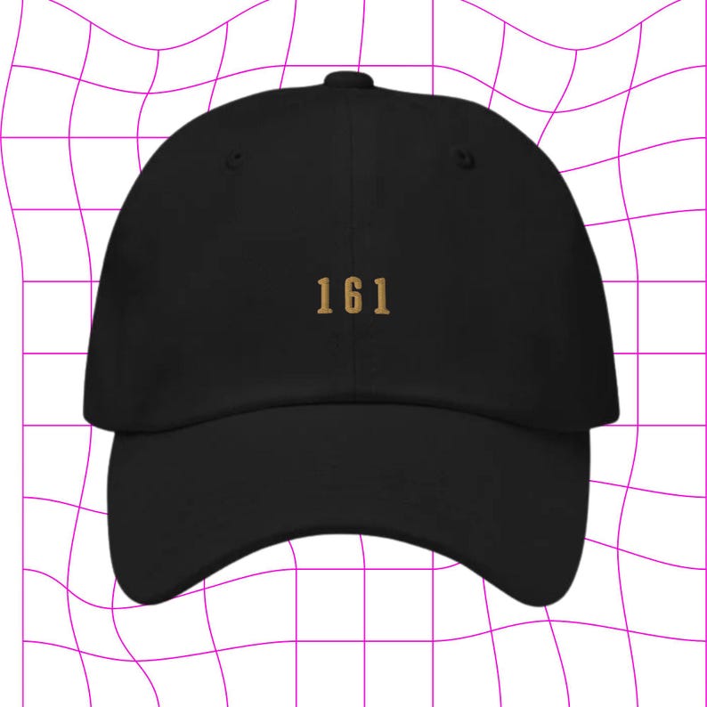 May include: A black baseball cap with a gold embroidered number "161" on the front.