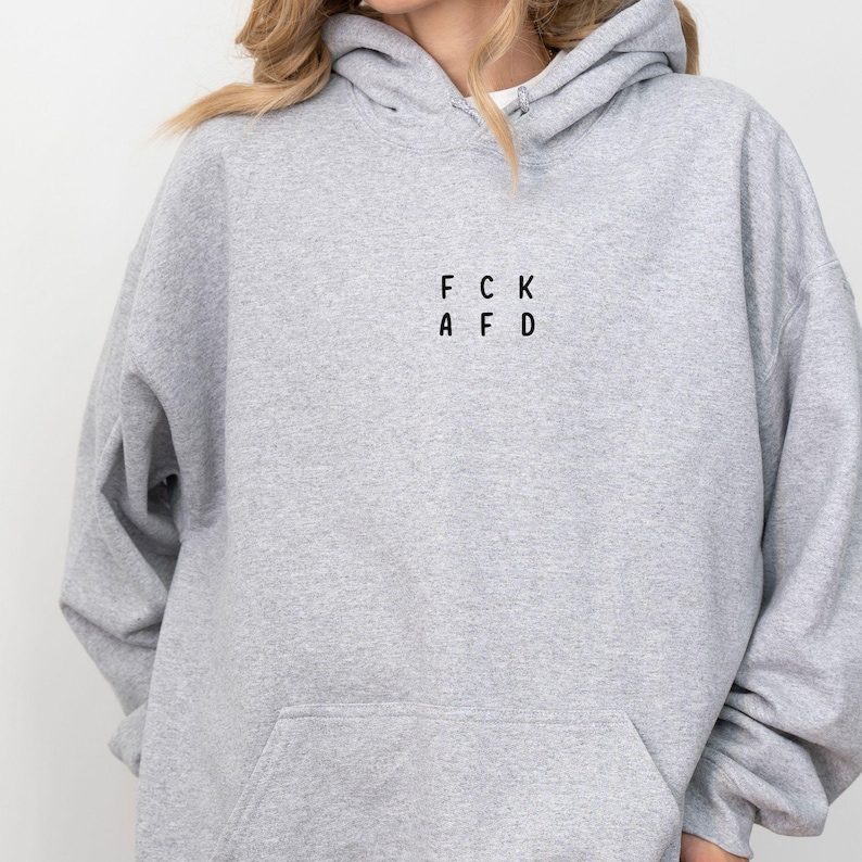 May include: A gray hooded sweatshirt with the text "FCK AFD" printed on the front.
