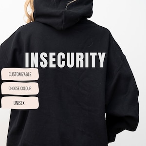 May include: Black hoodie with the word "INSECURITY" printed in white on the back. The hoodie is customizable and unisex.